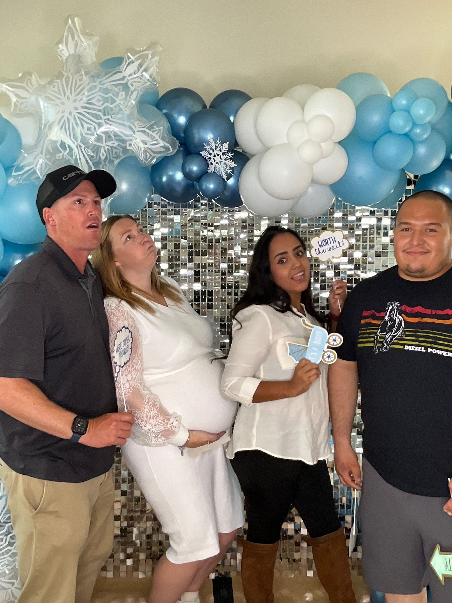 Wedding guests having fun with photo booth props at an estate wedding in Perris, CA