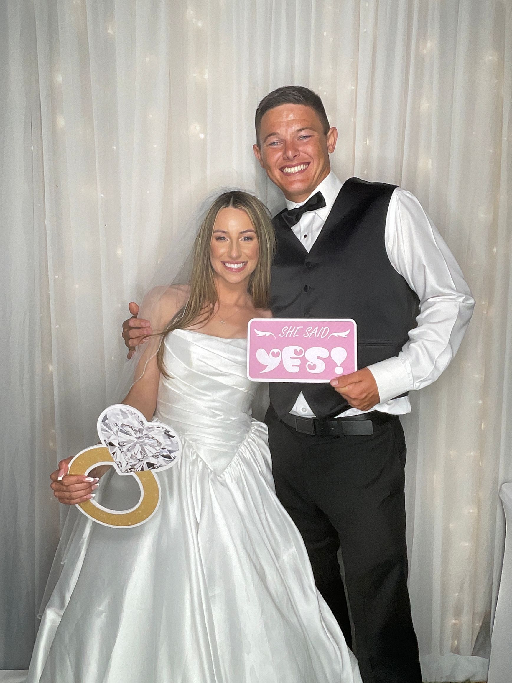 Jordan and Jimmy enjoying their wedding photo booth experience at a private estate in Perris, CA