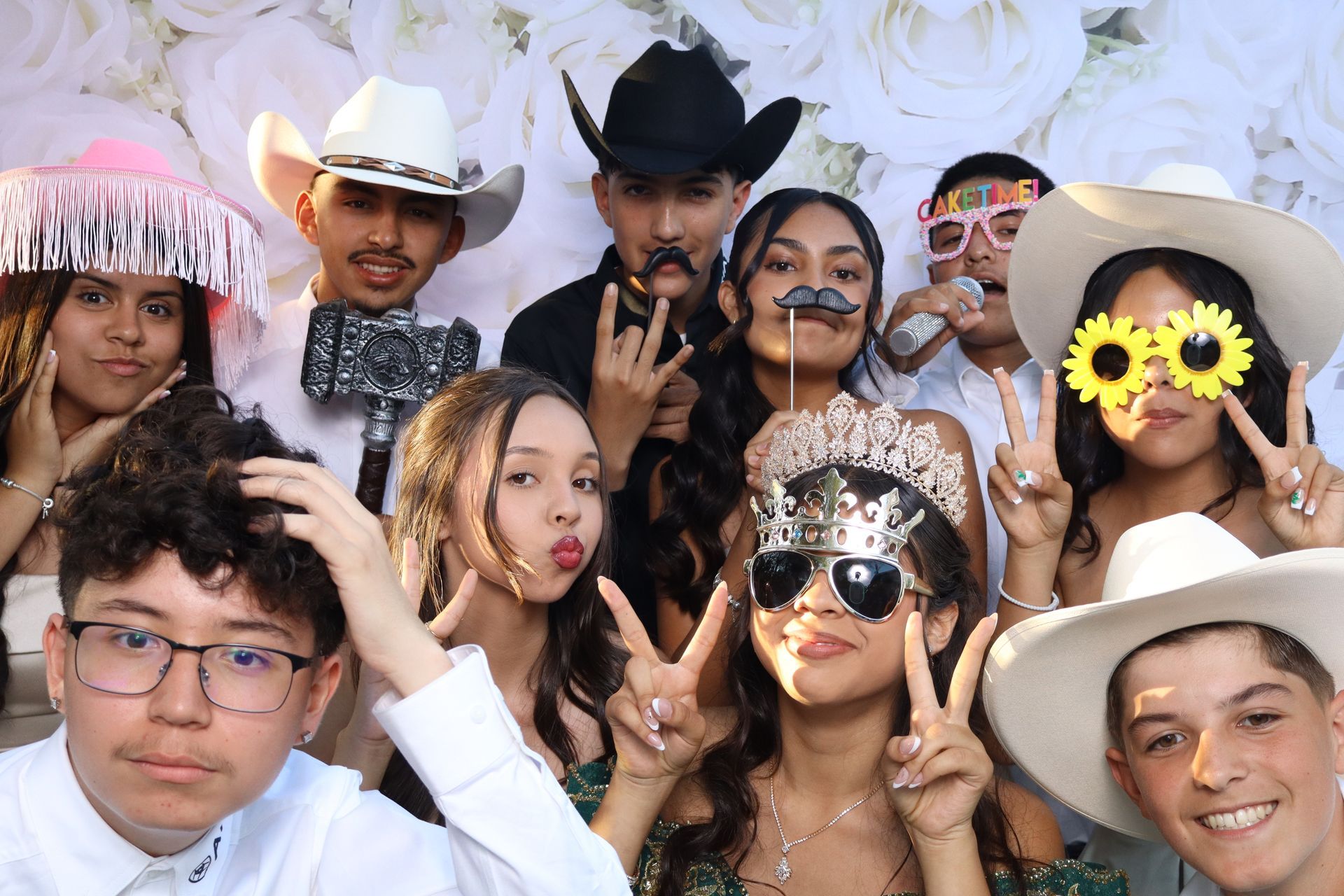 Guests enjoying a luxury photo booth at a quinceañera celebration