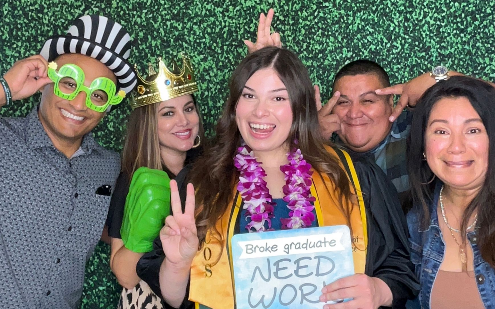 Graduate celebrating with Brightlight's digital photo booth at a graduation party