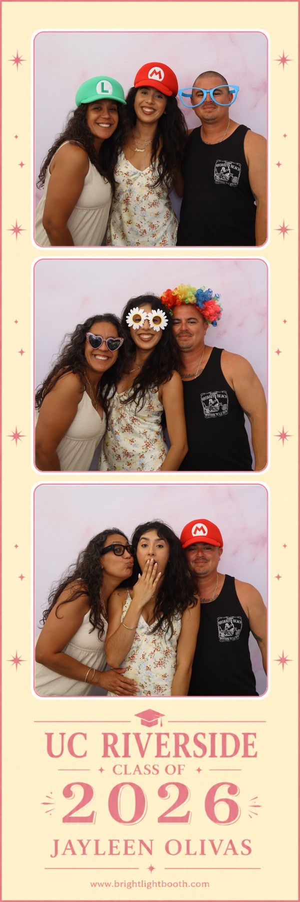 Graduation guests creating lasting memories with instant photo booth prints at a backyard UC Riverside graduation party in Jurupa Valley