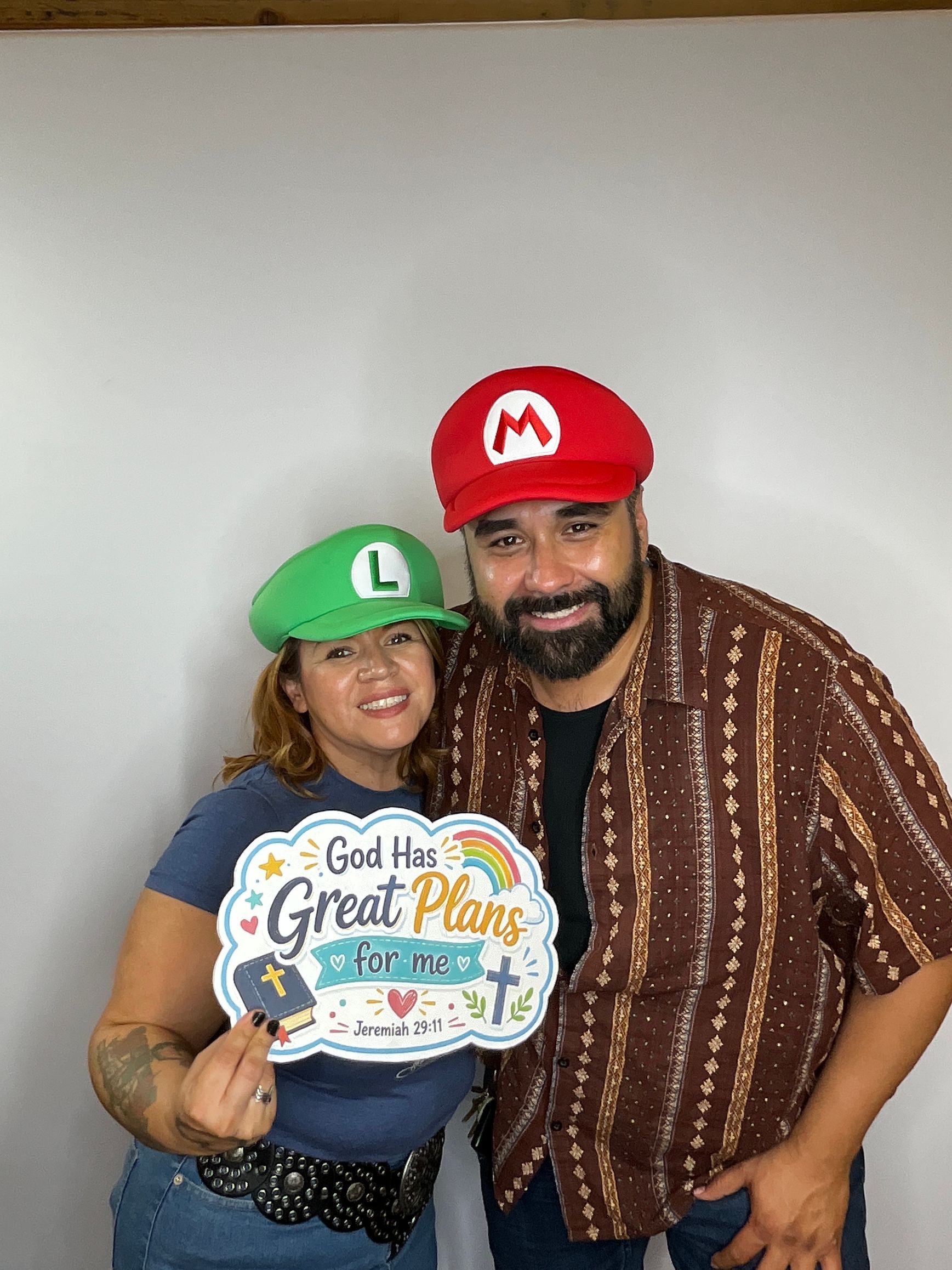 Guests posing with fun props at a Back to School Bash photo booth in Riverside, CA