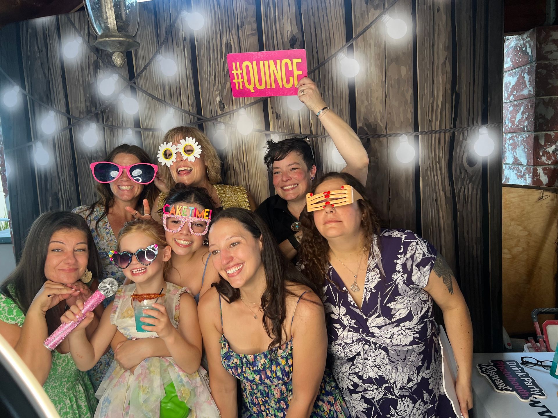 Guests enjoying the photo booth at Lizzie’s Quinceañera in Riverside, CA