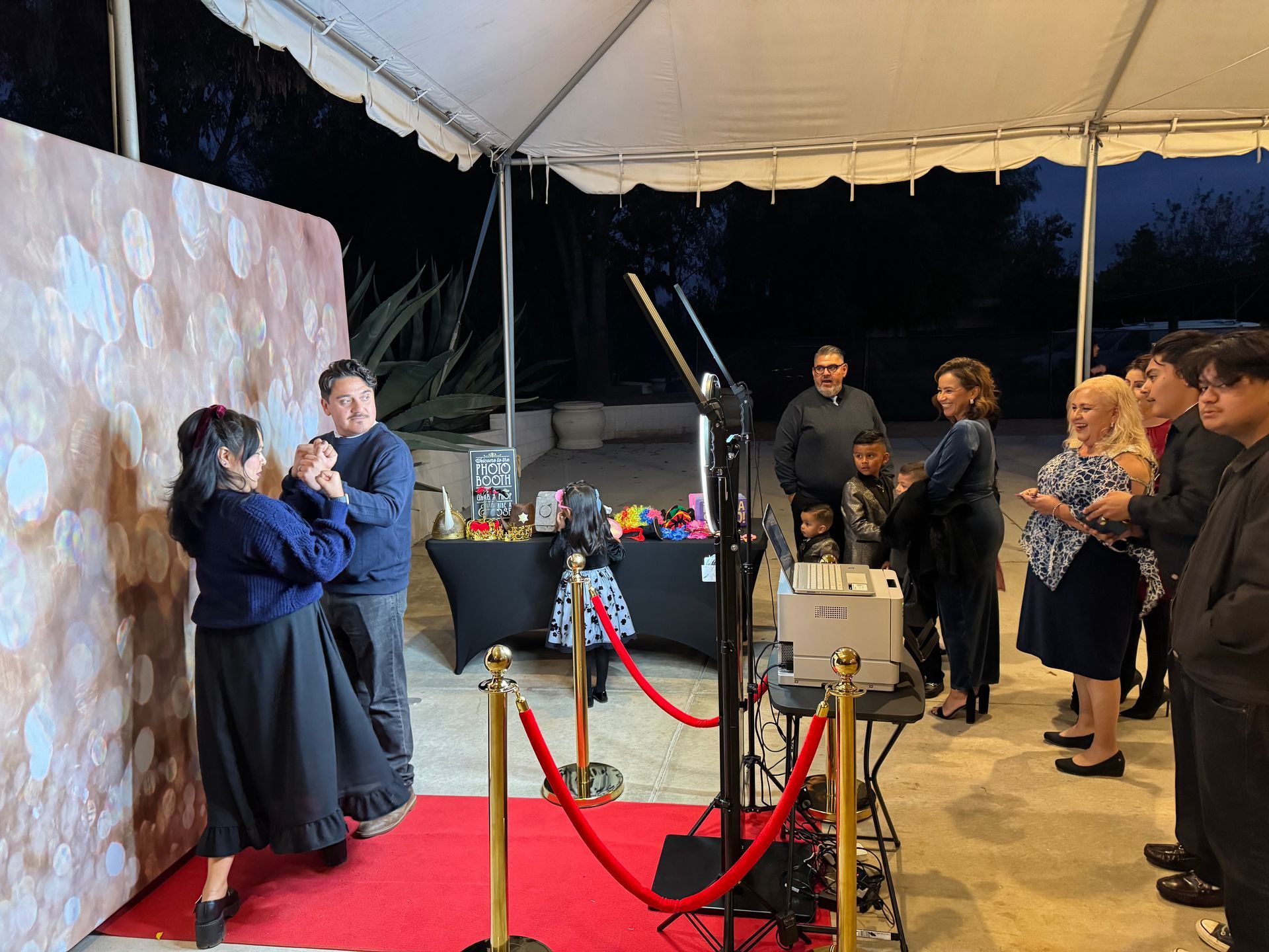 Luxury photo booth with red carpet at Cali's Quinceañera at Rancho Los Arcos in Wildomar, CA