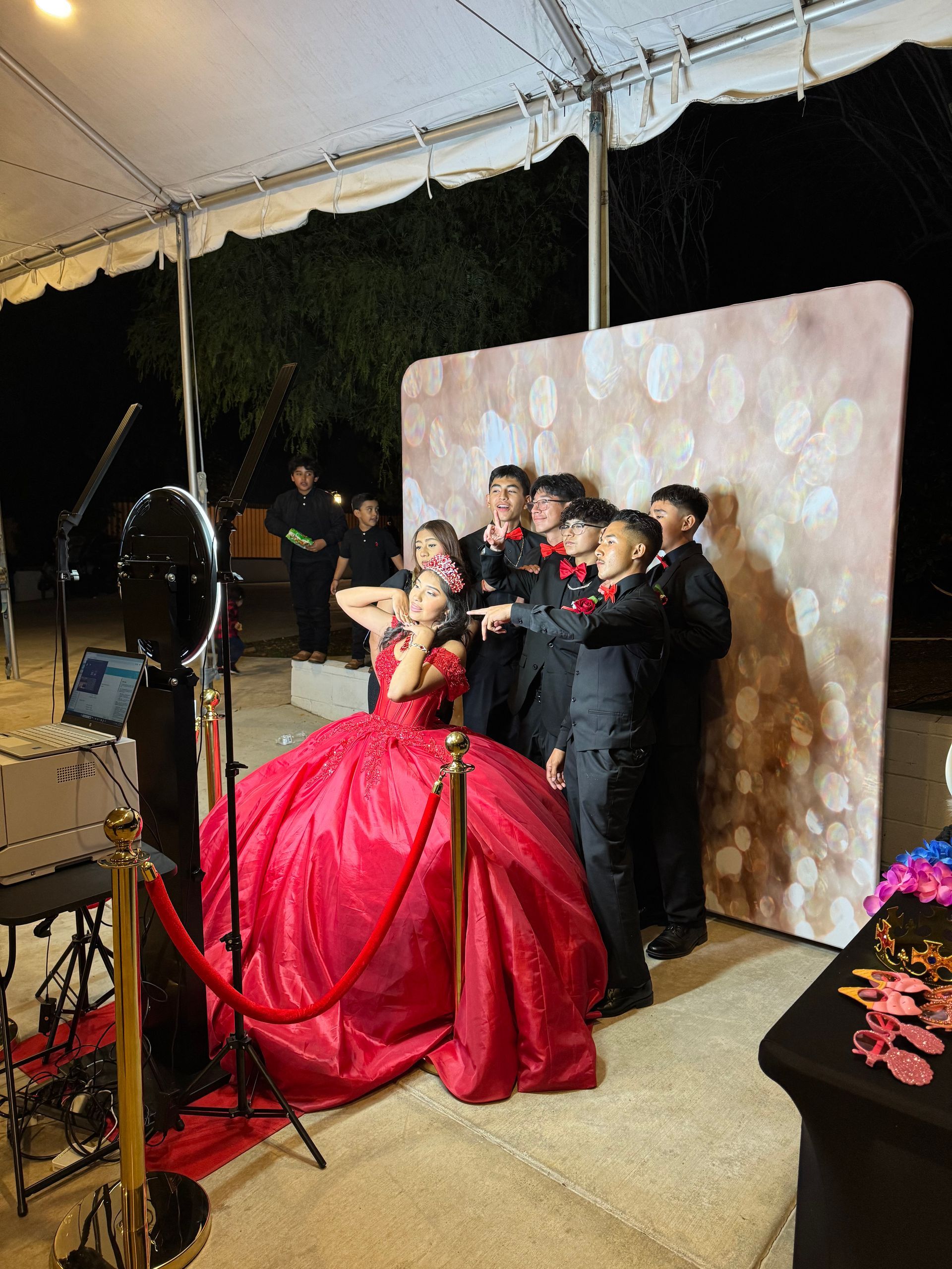 Cali posing with friends at her Quinceañera photo booth in Wildomar, CA