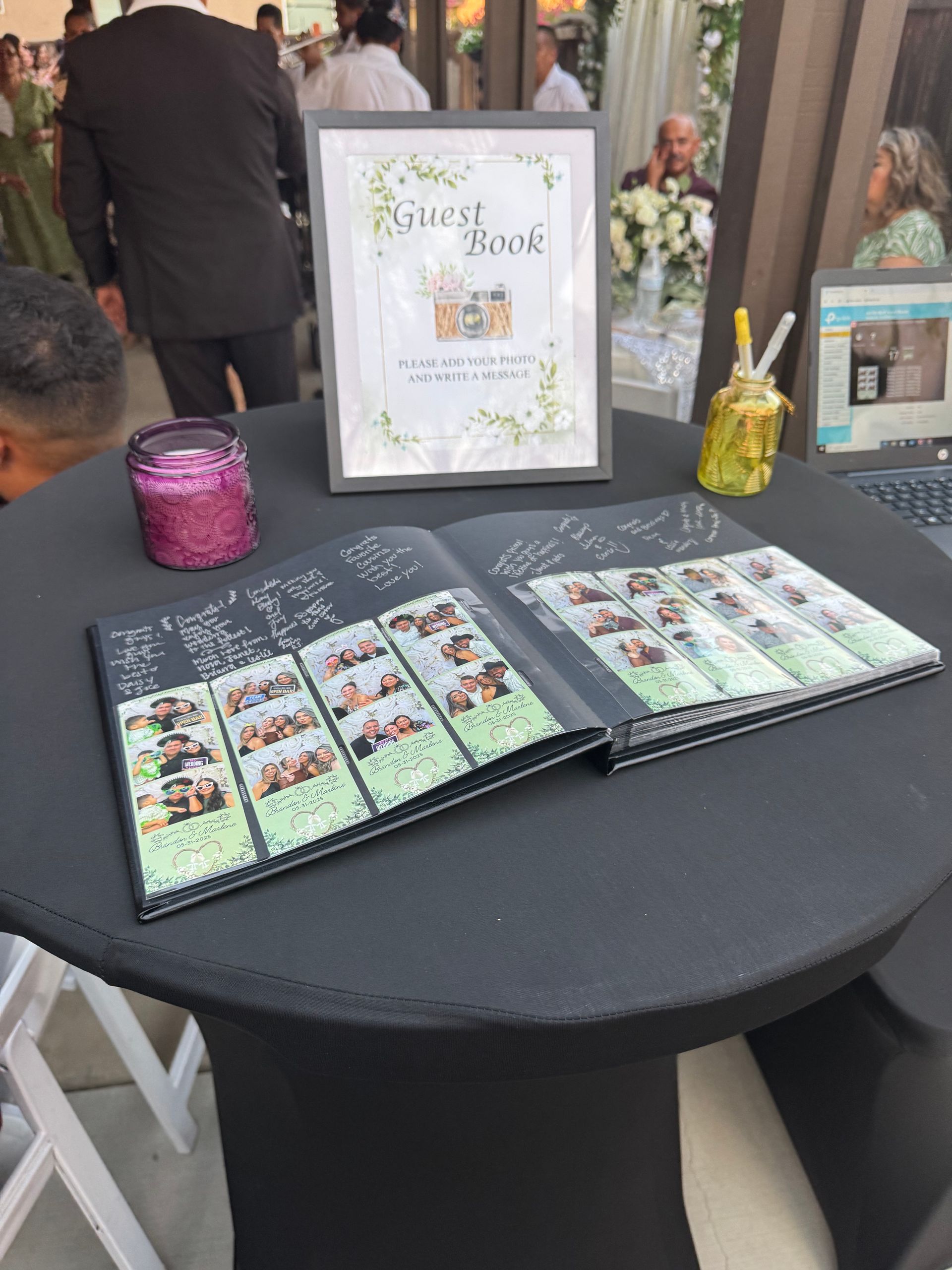 Wedding guestbook filled with photo booth prints and handwritten messages from guests at a Brightlight Photo Booth wedding
