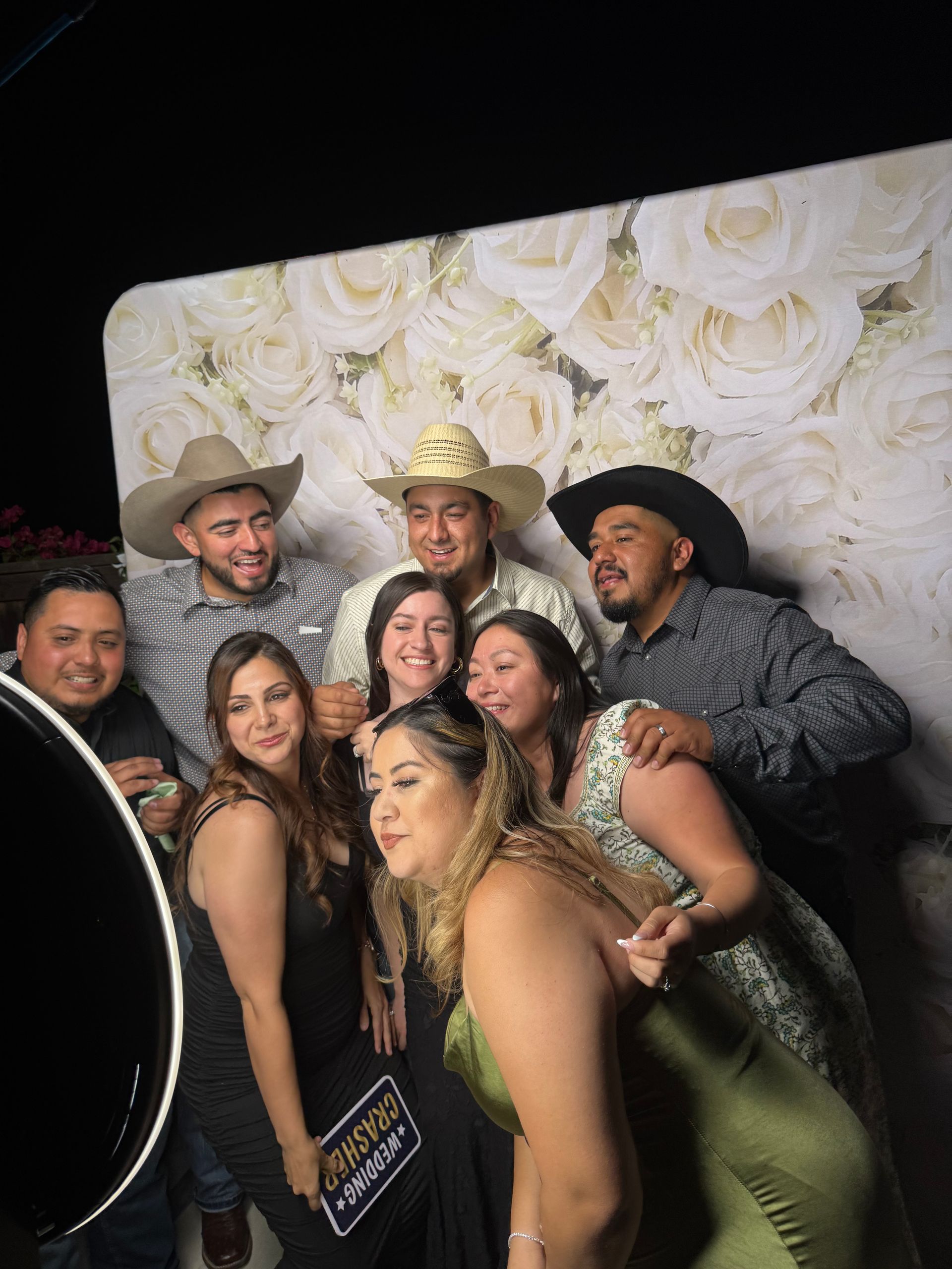 Guests enjoying Brandon and Marlene's wedding photo booth in Moreno Valley CA