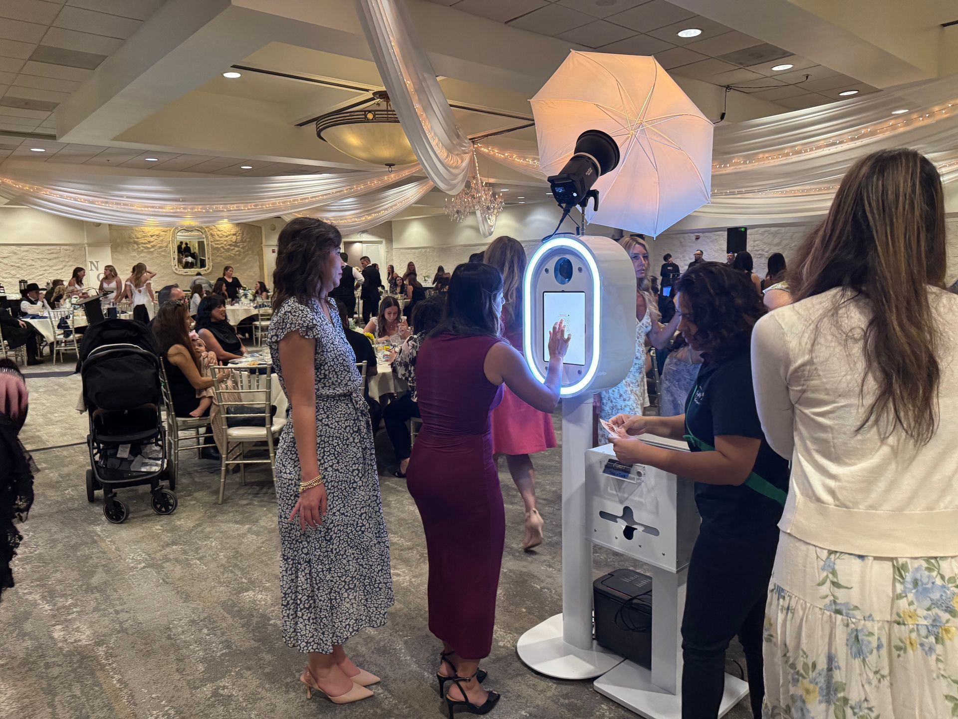 Modern photo booth rental at an indoor wedding reception