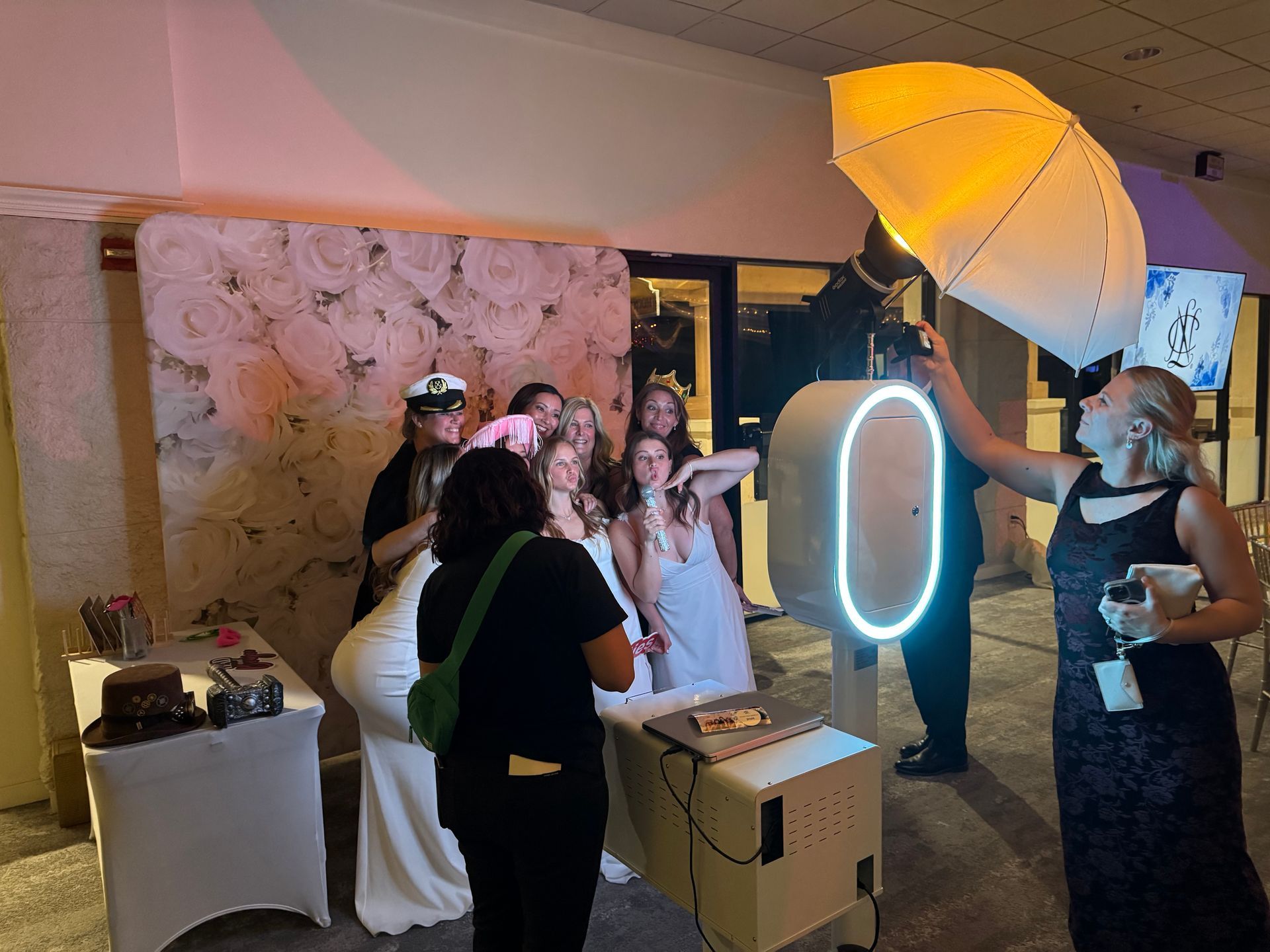 Wedding photo booth with elegant rose backdrop
