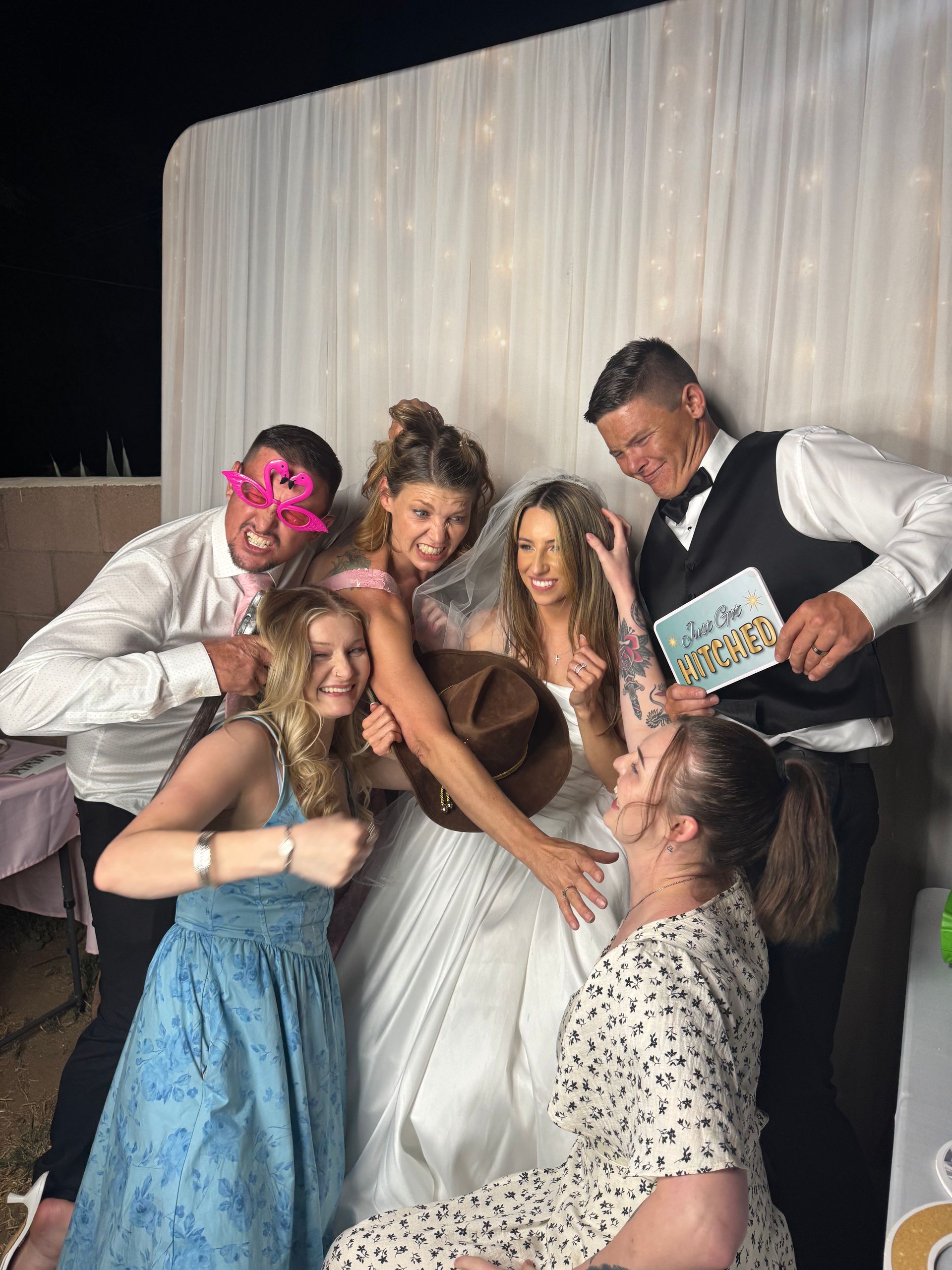 Wedding guests enjoying the Brightlight Photo Booth Experience at a wedding in Perris, CA
