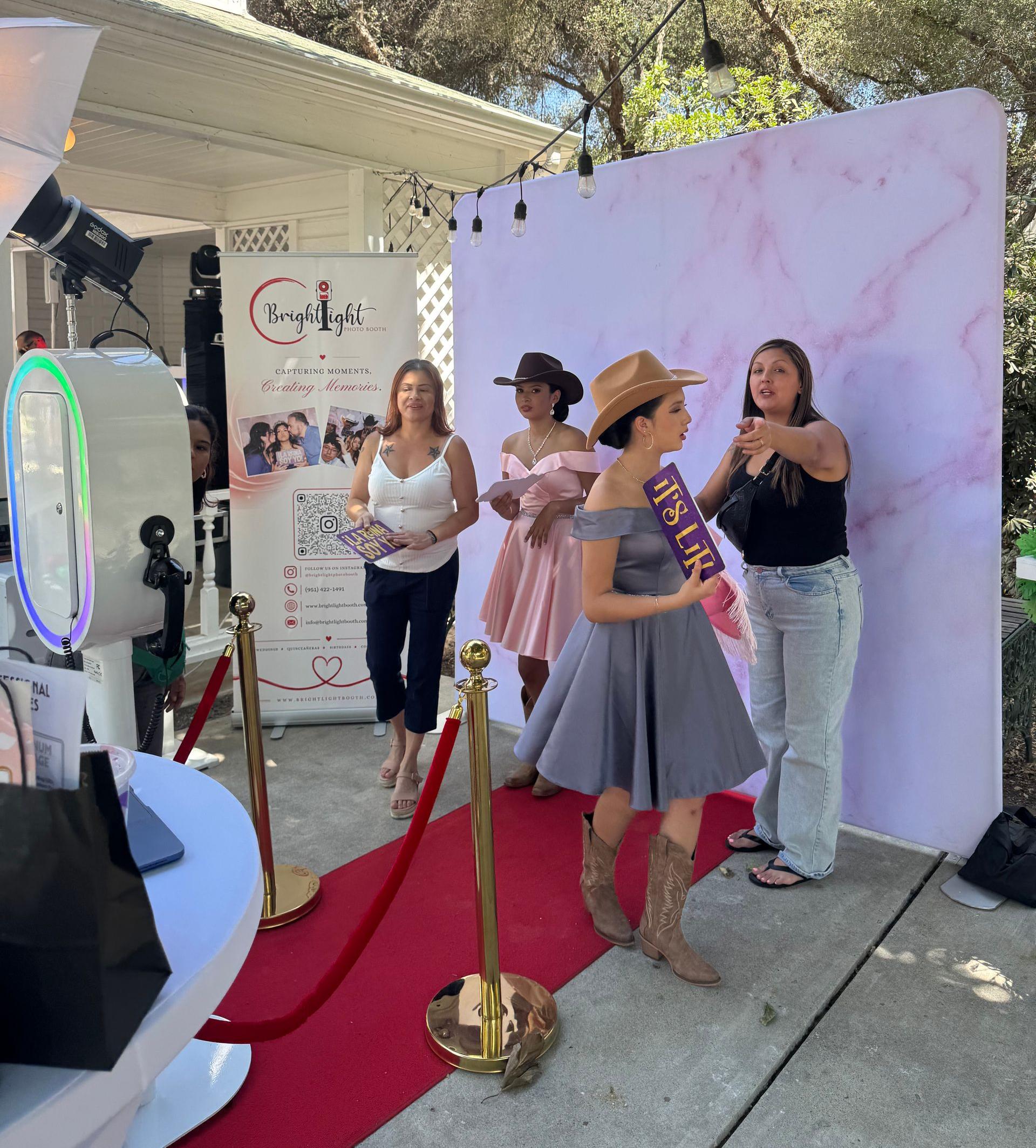 Guests enjoying the Brightlight Photo Booth at the Quinceañera Glam Expo 2026