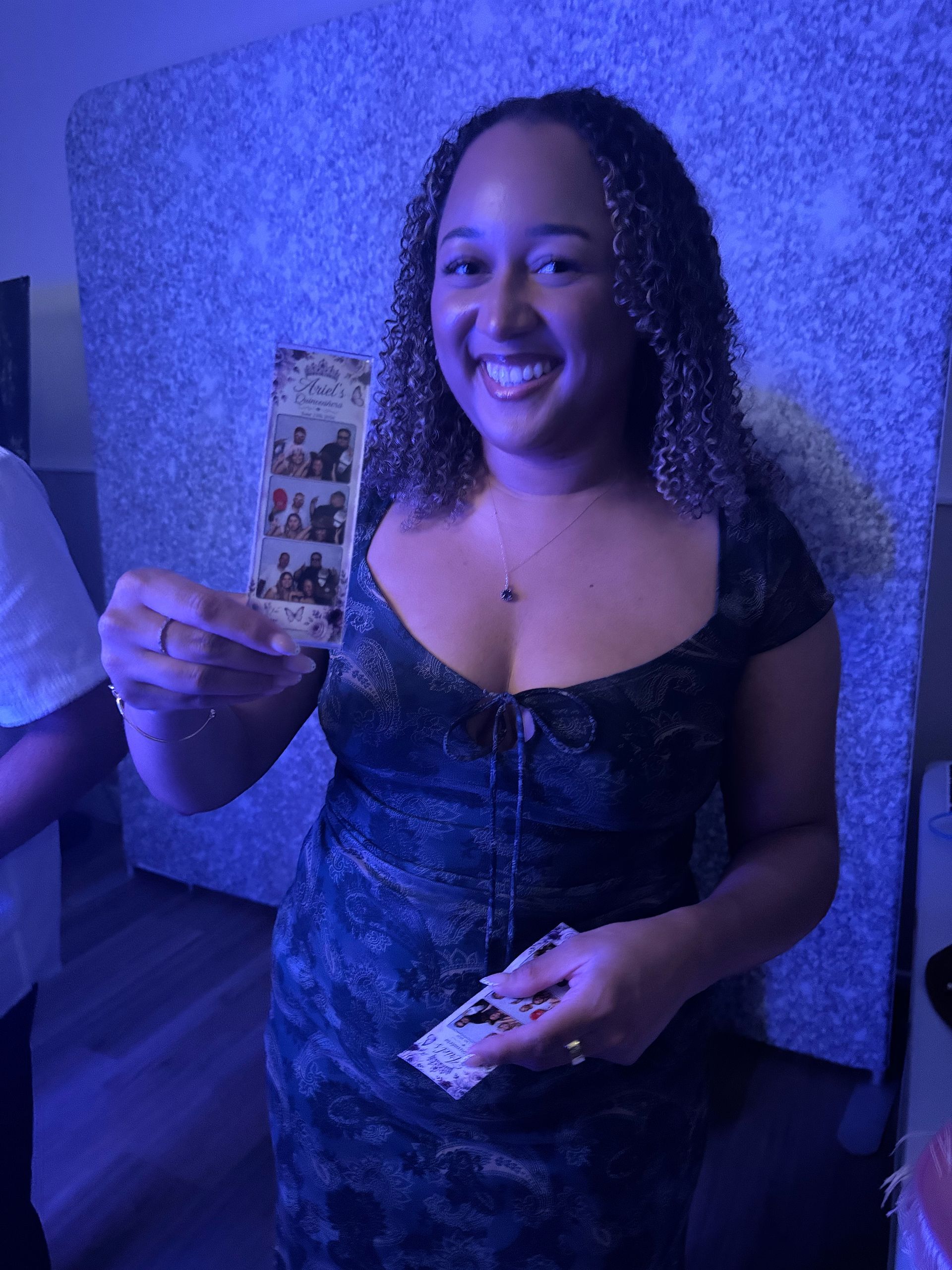Guest holding a custom photo booth print strip