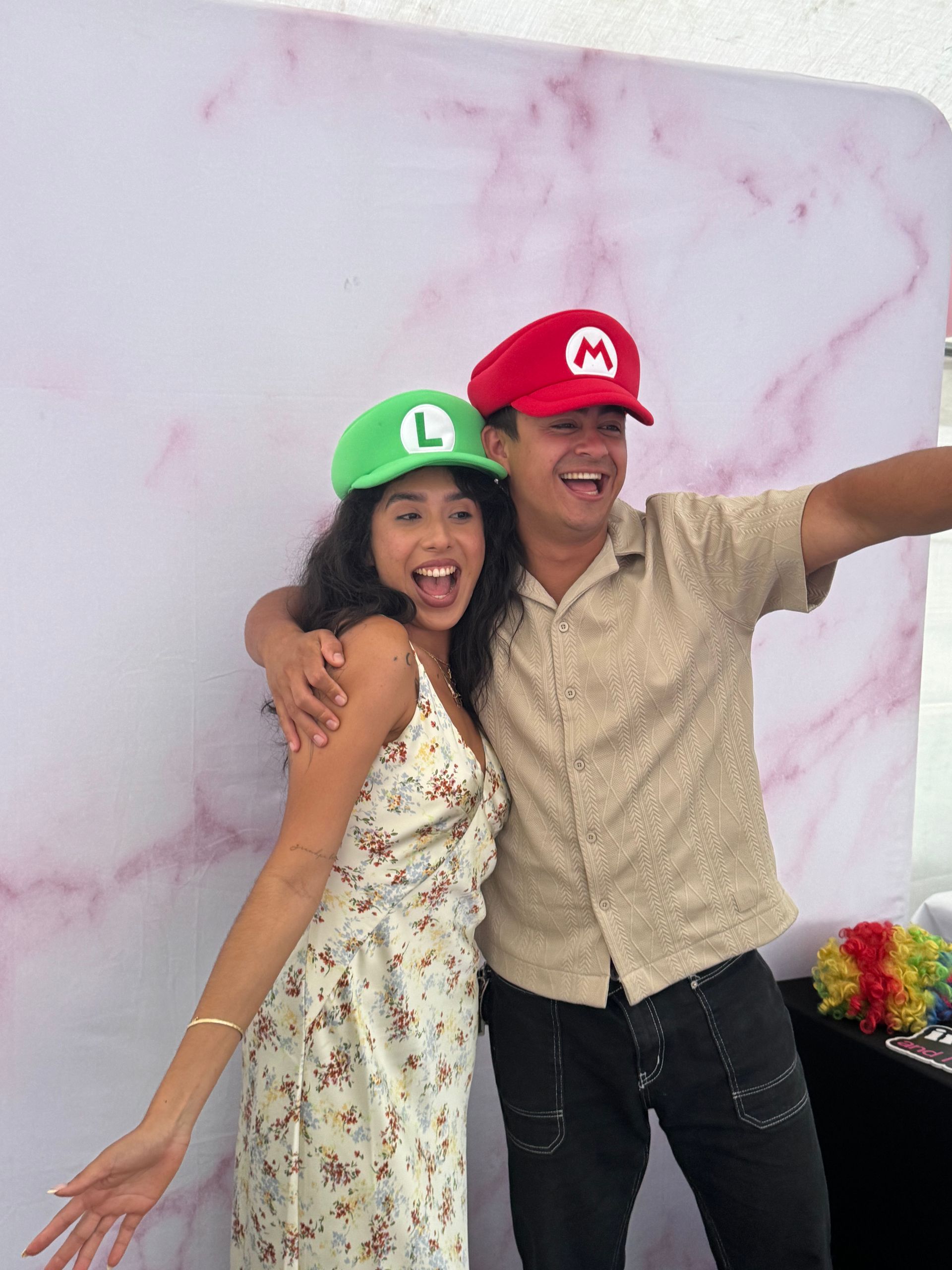 Guests wearing fun graduation props and posing for photos at a UC Riverside graduation party in Jurupa Valley, CA