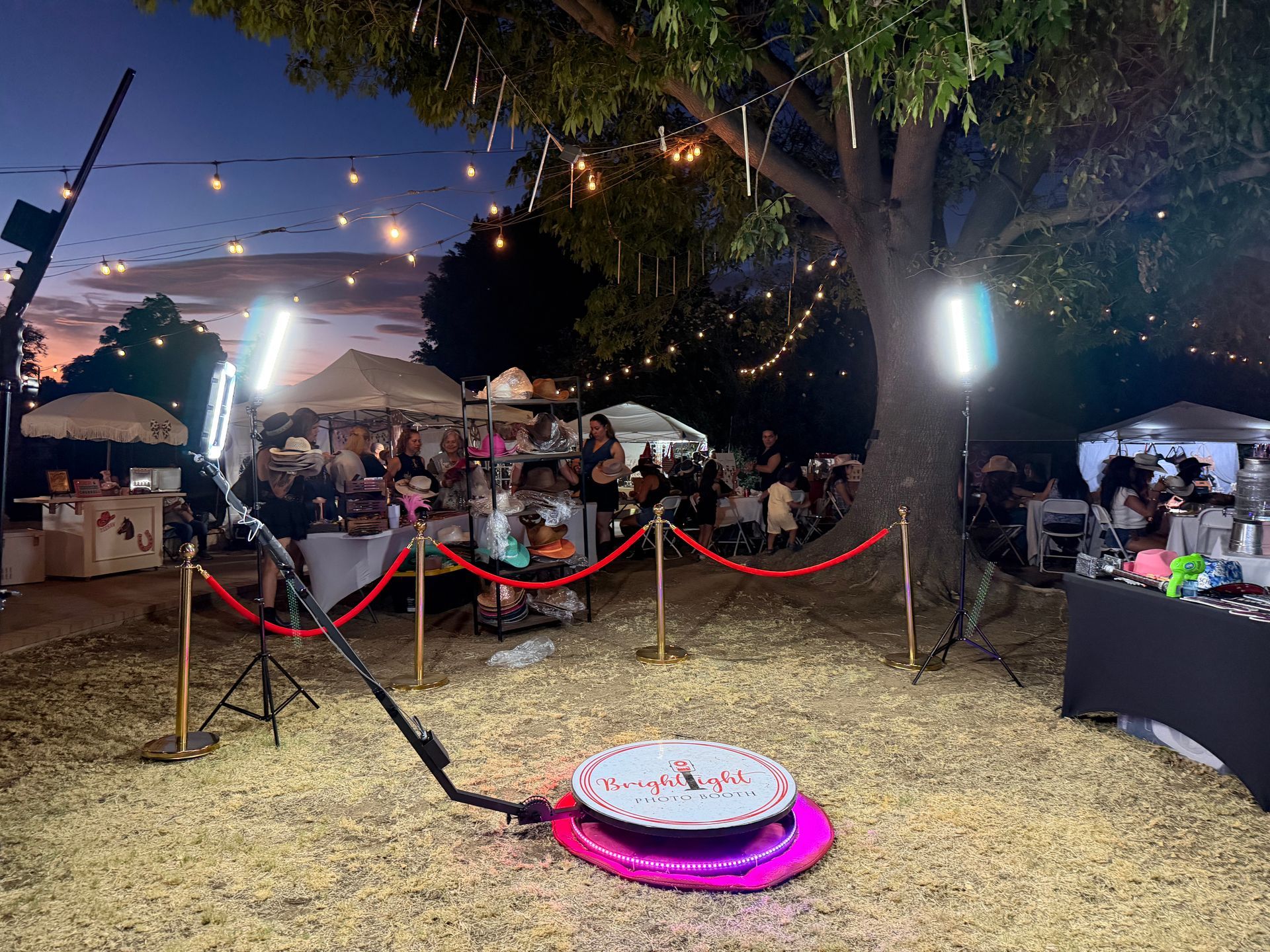 360 Photo Booth setup with platform and professional lighting for an outdoor event