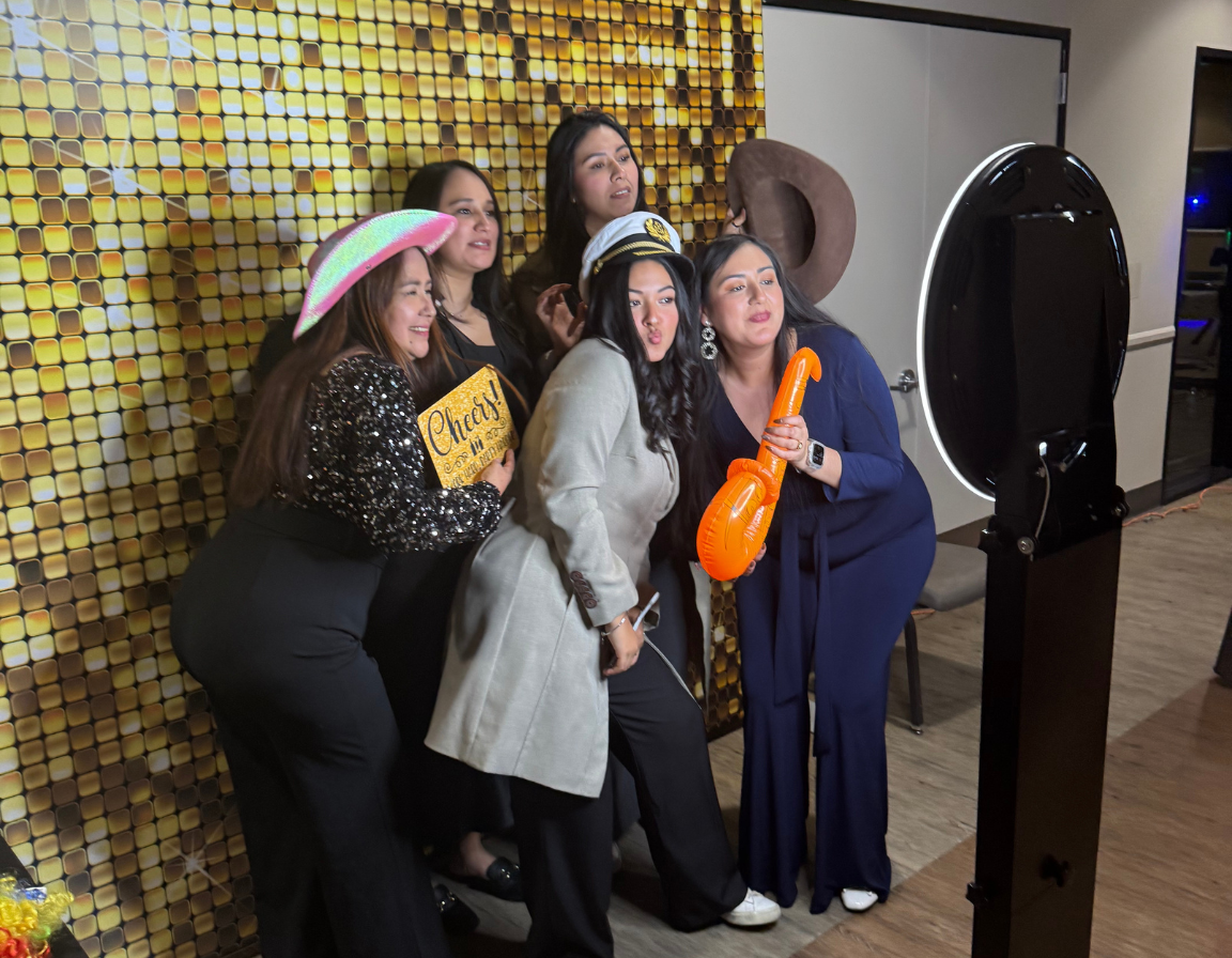 Guests enjoying Brightlight Photo Booth's Signature Digital Experience at a birthday celebration