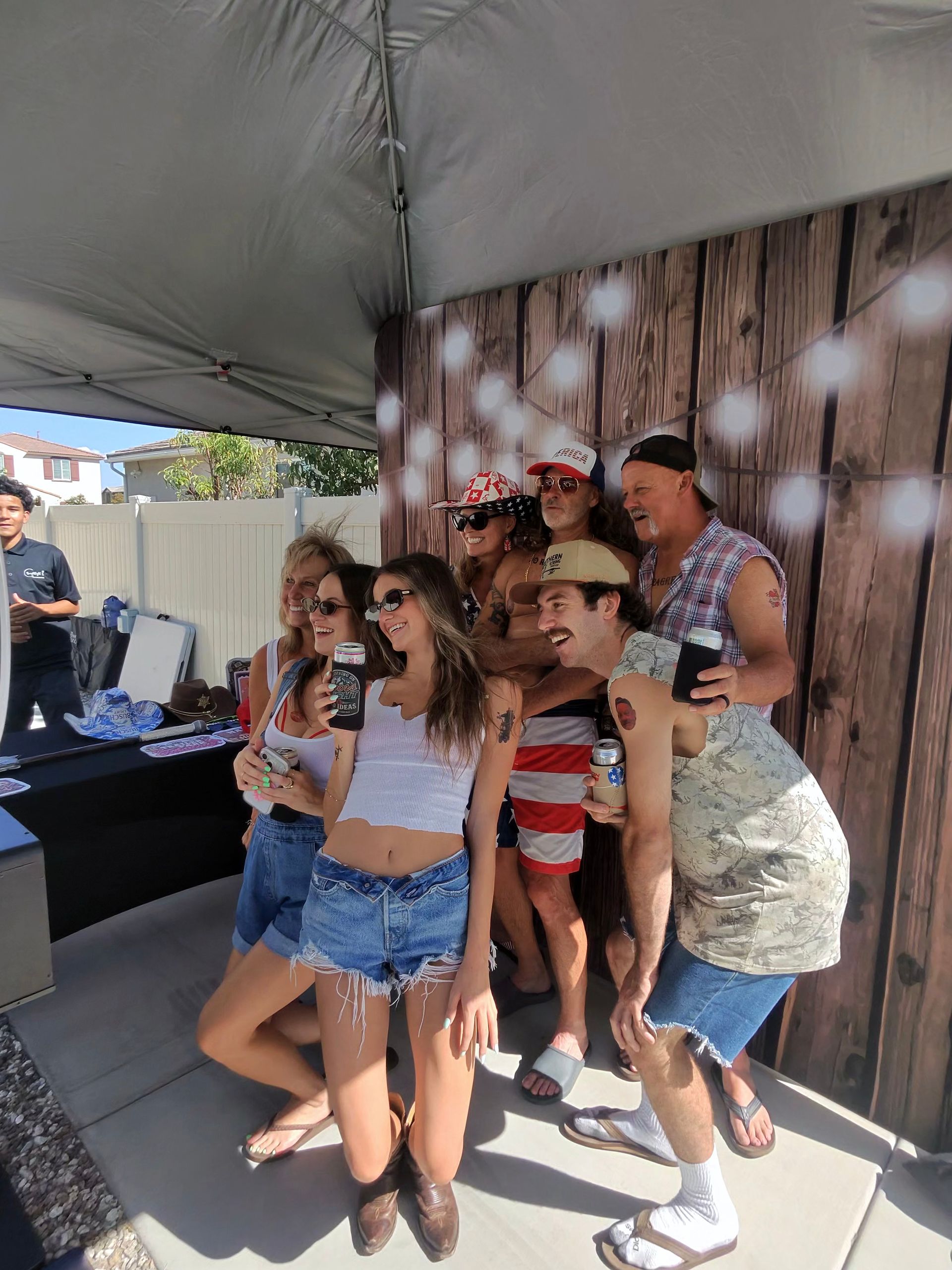 Friends posing together at Rich’s 60th birthday photo booth in Menifee, CA