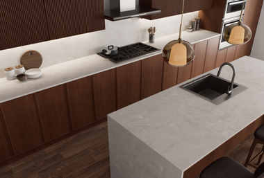 Modern kitchen with wood cabinets, light countertops, and island with sink.