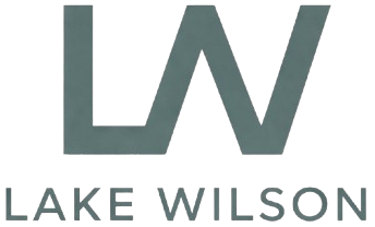 Lake Wilson logo with stylized gray “LW” and the words “LAKE WILSON” below