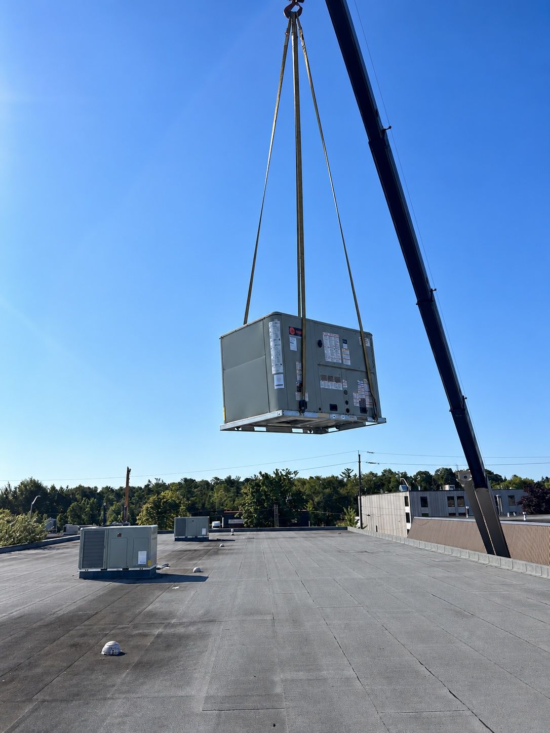 HVAC technician assessing industrial HVAC unit