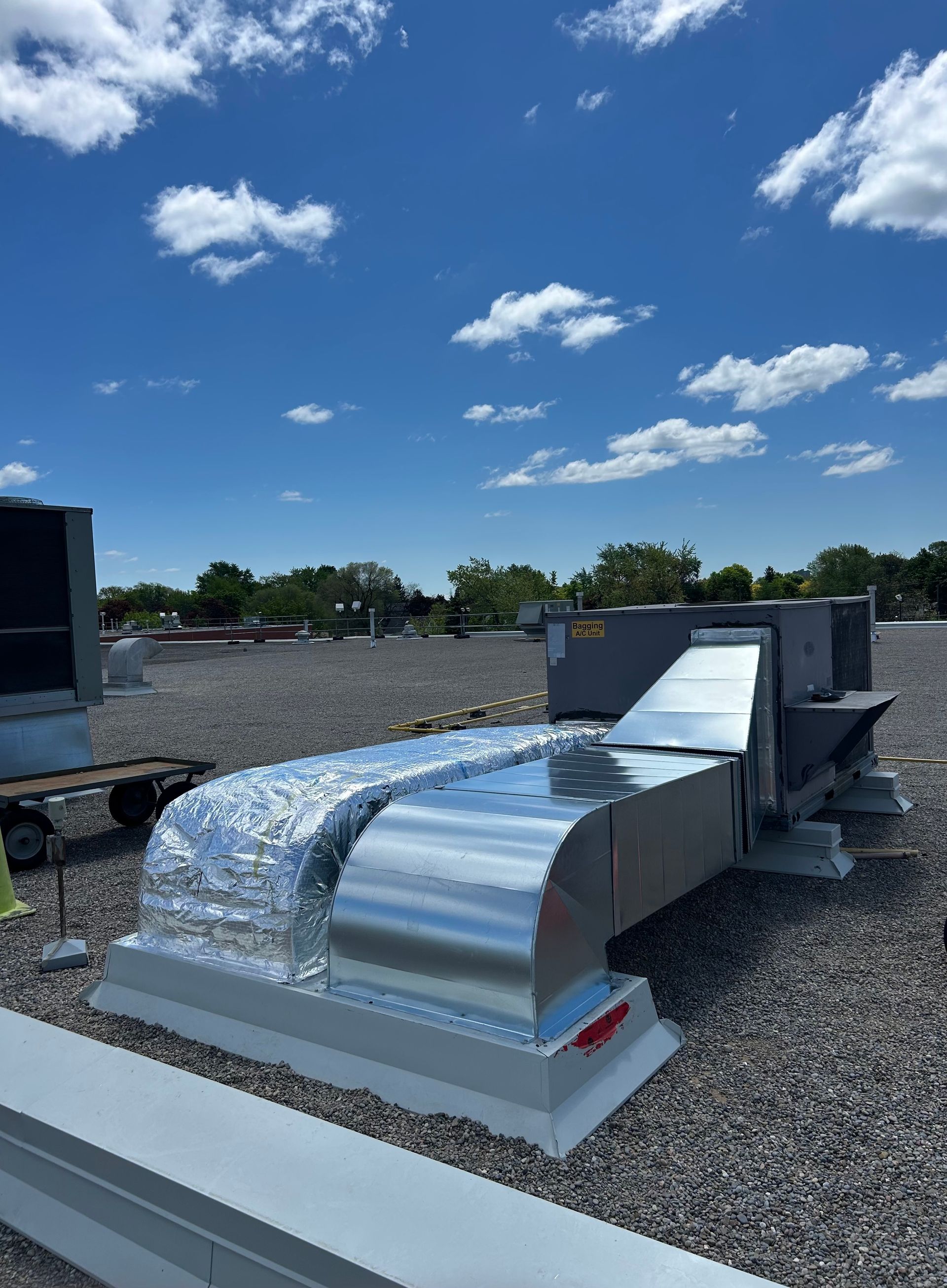 HVAC technician repairing heating and cooling unit