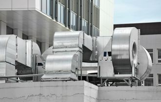 industrial HVAC unit on top of institutional building