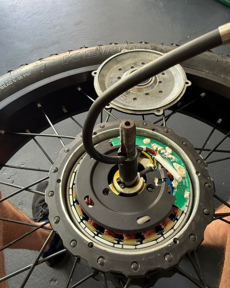 an Opened E-bike Motor With Circuit Board, Wires, and Rotor Exposed — E-Go-Try-Bikes in Nelson Bay, NSW