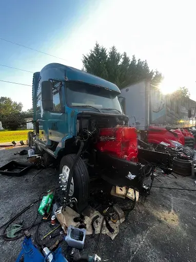 A maroon semi-truck parked outdoors.