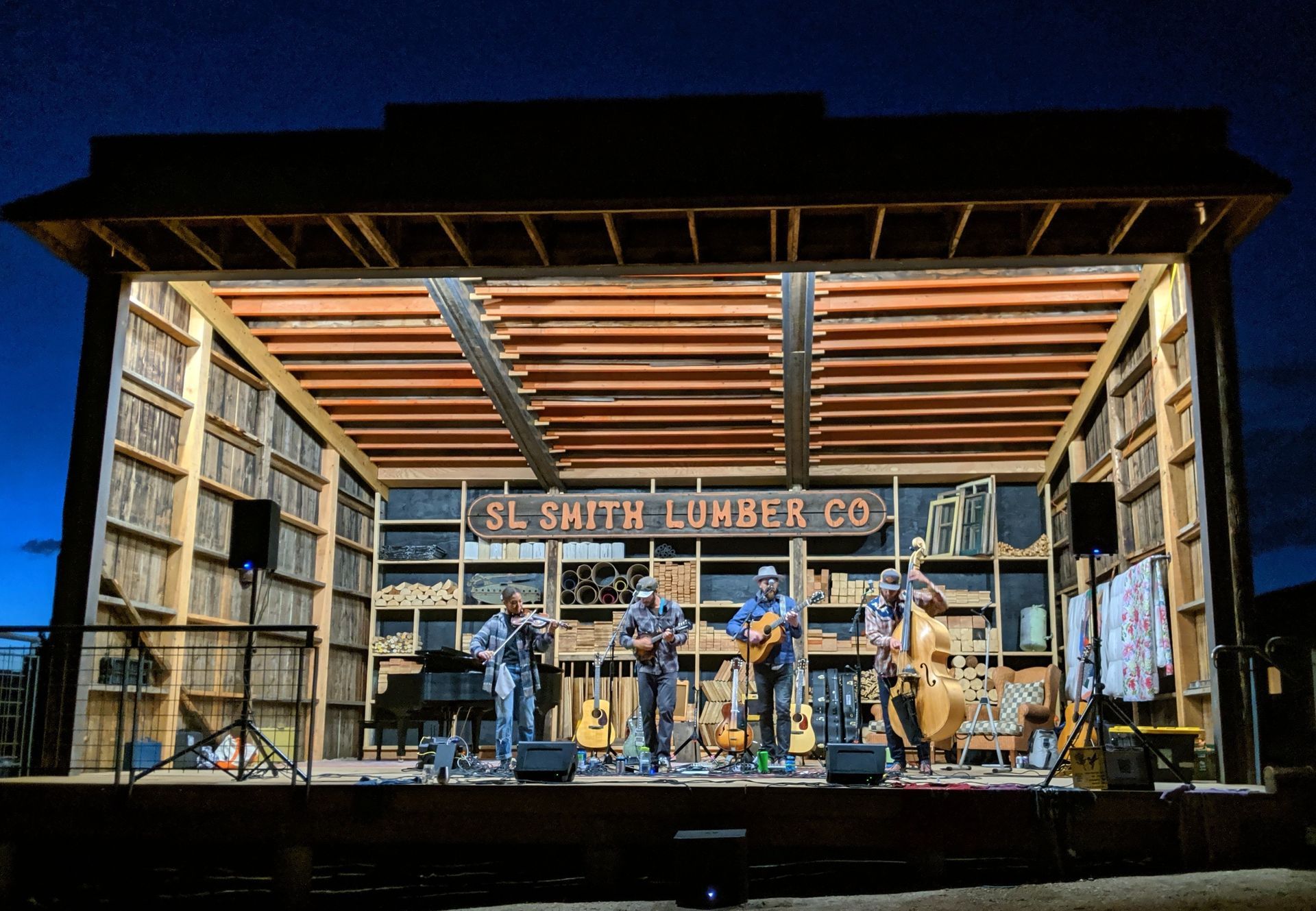 A group of people are playing instruments on a stage.