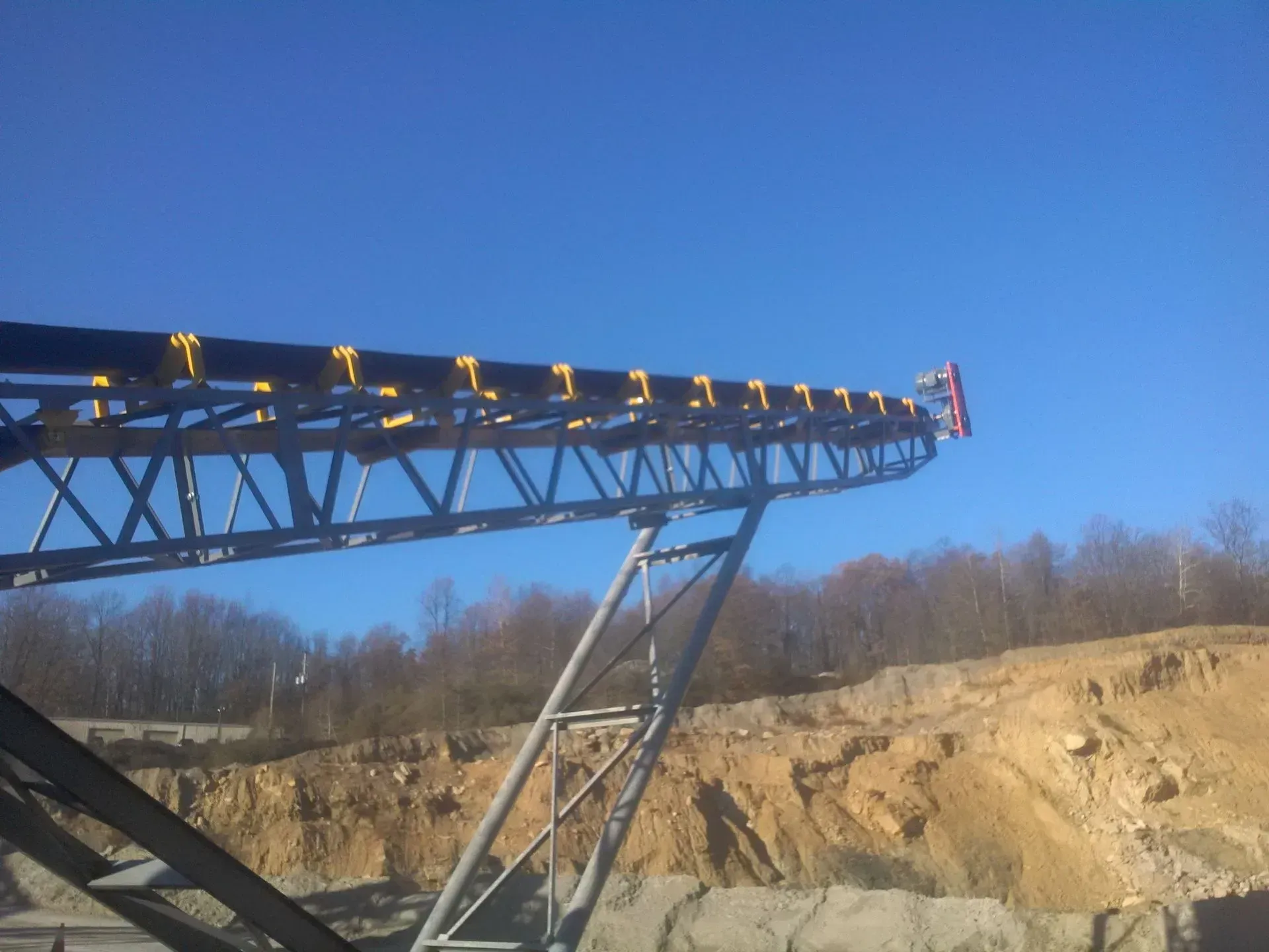 A conveyor belt with the letter x on it.