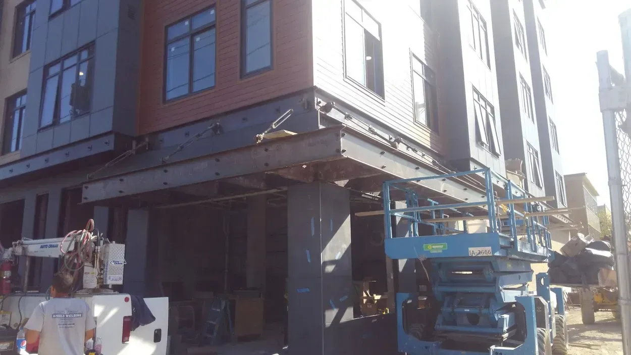 A large building with a lot of windows is being built.