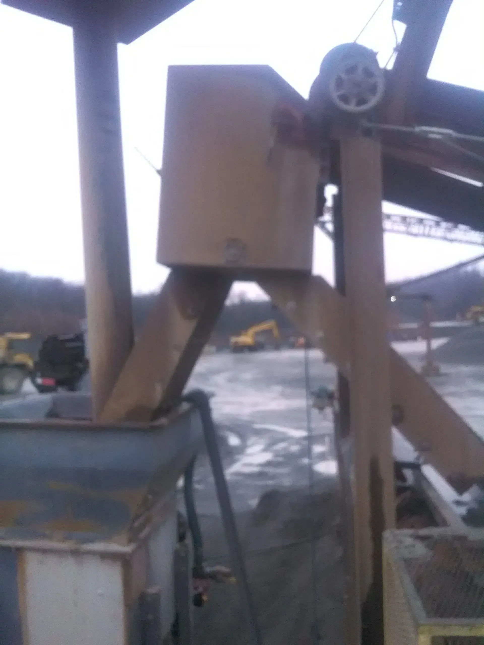 A machine with a box on top.