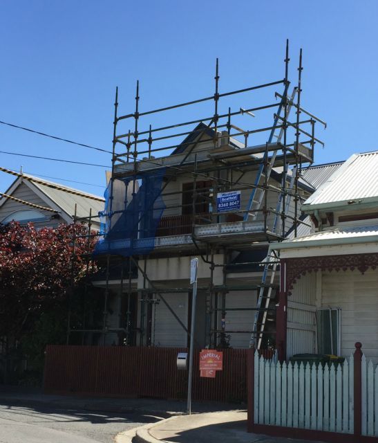 A house with scaffolding on the side of it