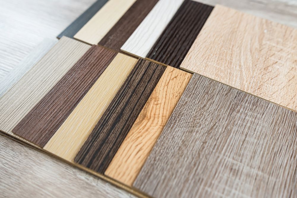 Variety of wood flooring samples in various shades and textures.