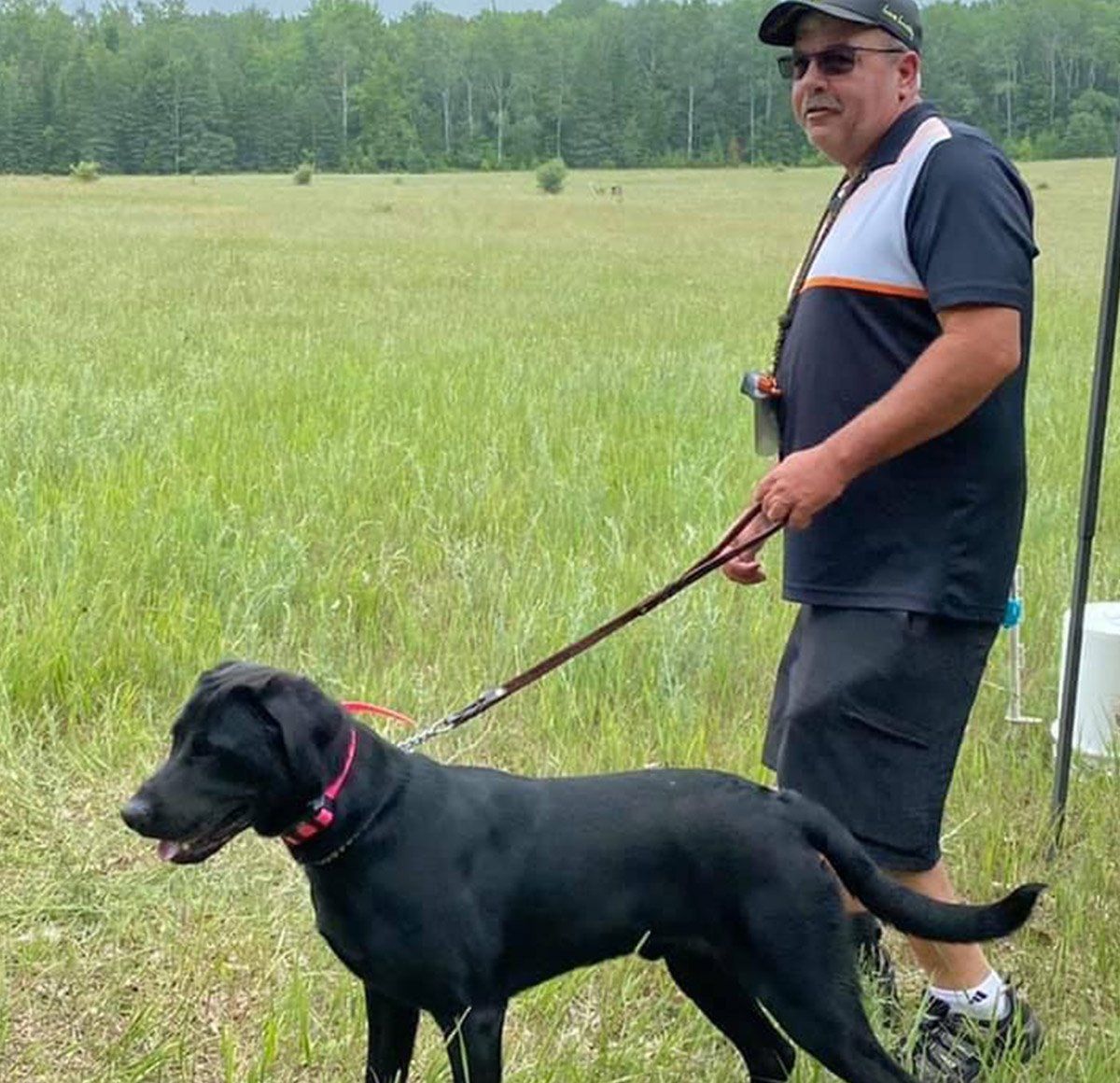 Black Dog And A Trainer — Freeland, MI, — Windy Acres Kennels Black Dog And A Trainer — Freeland, MI, — Windy Acres Kennels