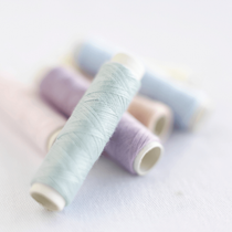 Bobines de fils pastel Gkhan couture Lausanne
