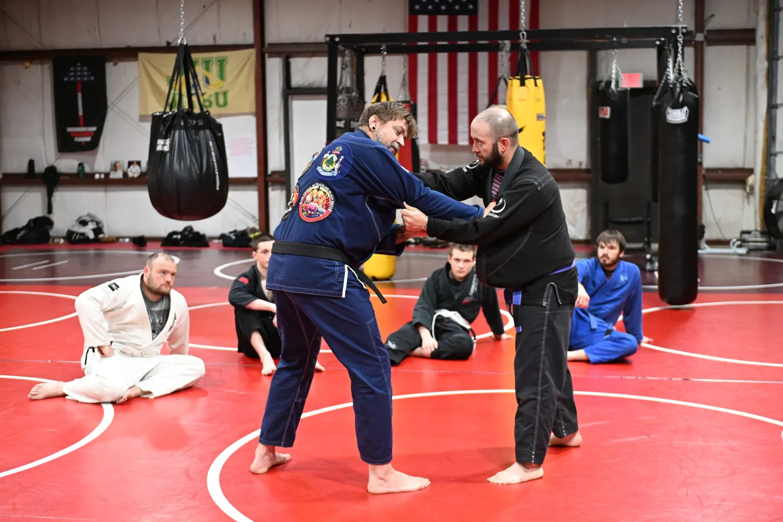 Students practicing Jiu-Jitsu at Roberts Family Mixed Martial Arts in Orange, MA, building strength.