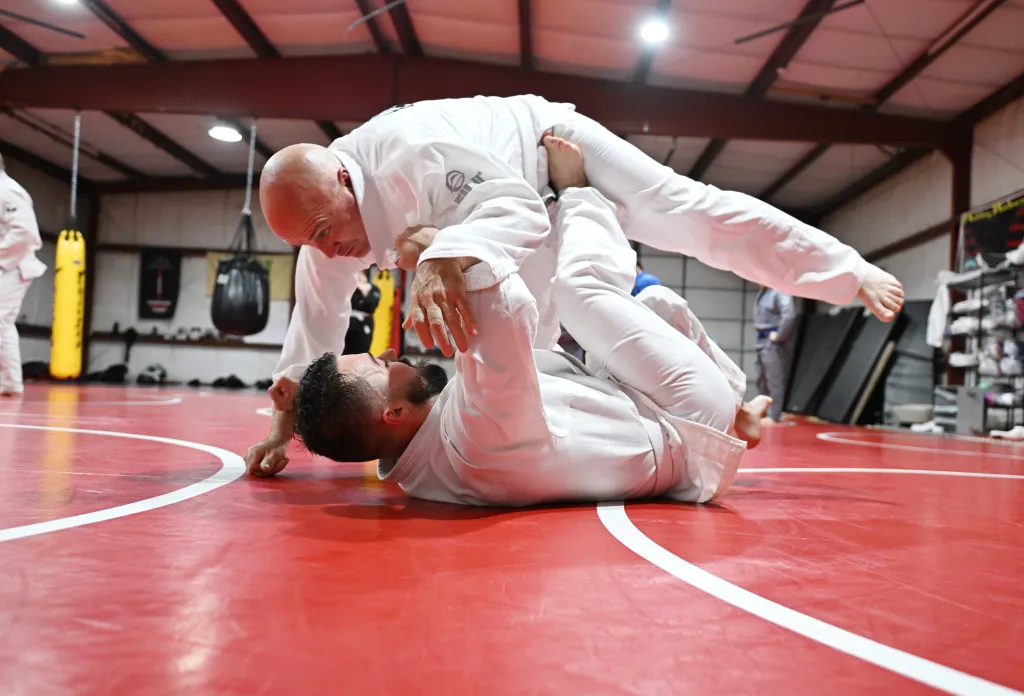Students practice MMA self-defense drills at Roberts Family Mixed Martial Arts in Orange, MA for confidence and safety.