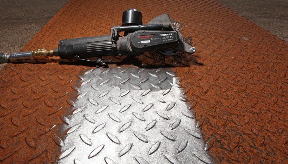 A tool is sitting on top of a metal surface ready for galvanising.