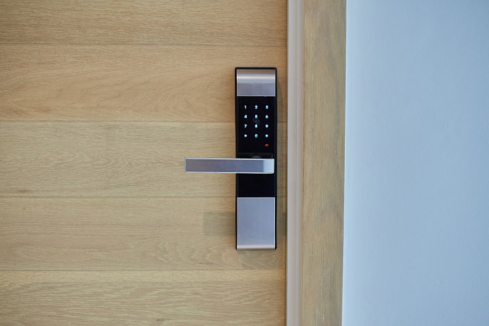 A Close Up of a Digital Door Lock on a Wooden Door — Ontime Locksmiths & Security In Cabarita, NSW