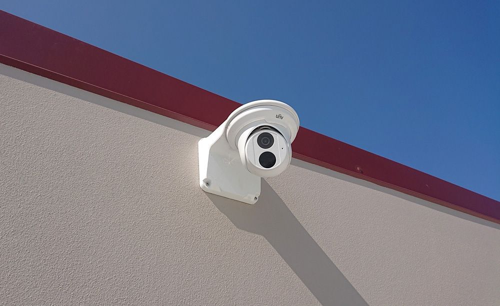 Security Camera Mounted On The Side Of A Building — Ontime Locksmiths & Security In Byron Bay, NSW