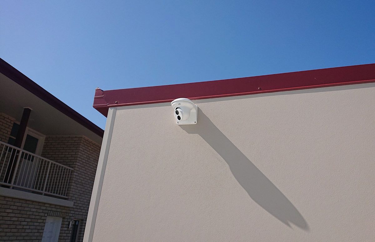 A Security Camera Mounted On The Wall Of A Building — Ontime Locksmiths & Security In Byron Bay, NSW