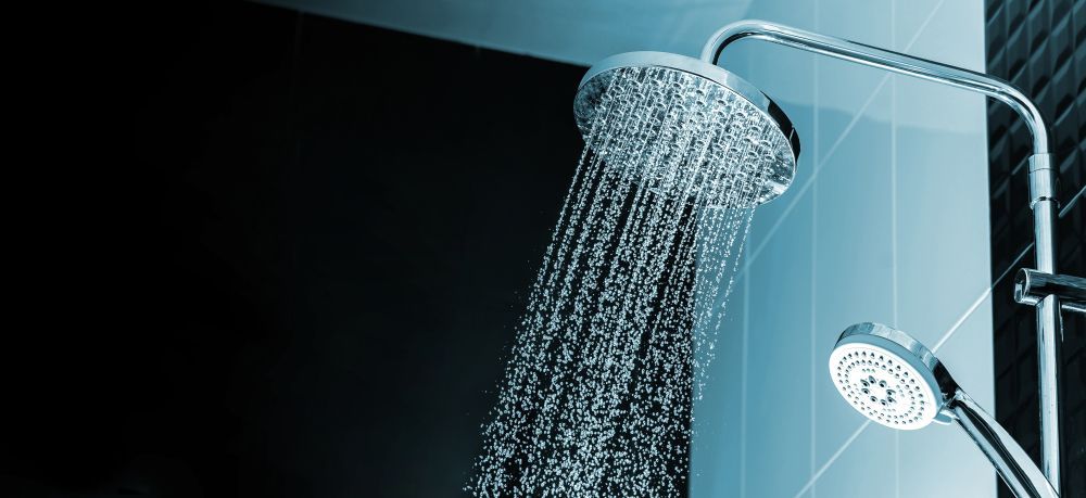 A Shower Head With Water Coming Out Of It In A Bathroom — Cairns Clear Water Company In Westcourt, QLD