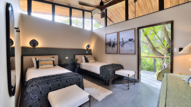Spacious luxury guest room at Conga Boutique Hotel with modern amenities in Puerto Viejo