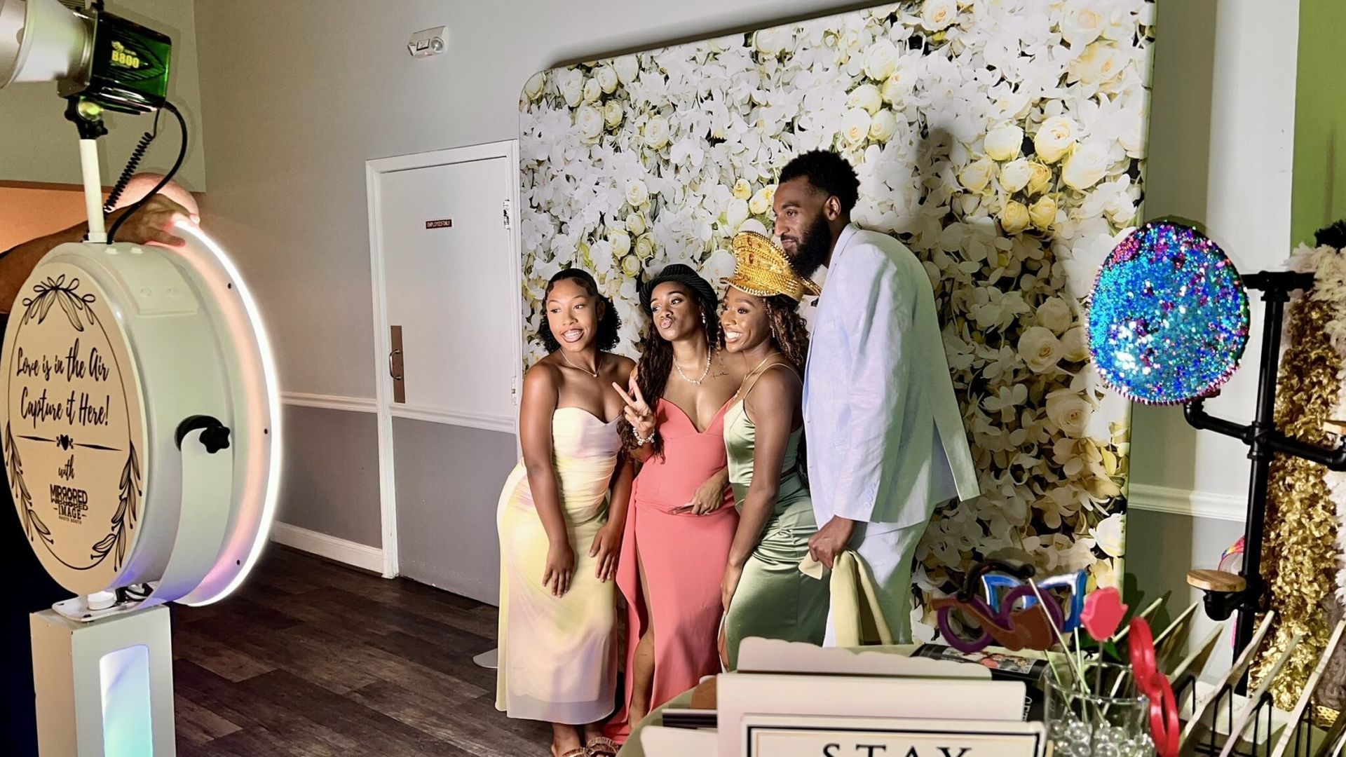 guests in a photo booth at anchor inn pasadena md