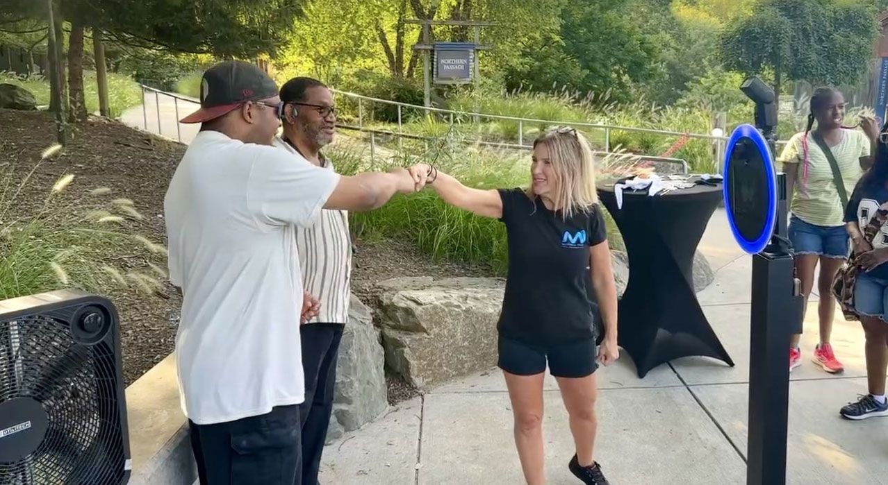guests taking a picture in a photo booth at the maryland zoo