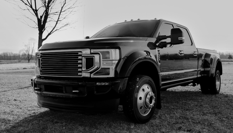 Black truck parked outside, black and white filter | Pasco Auto Diesel