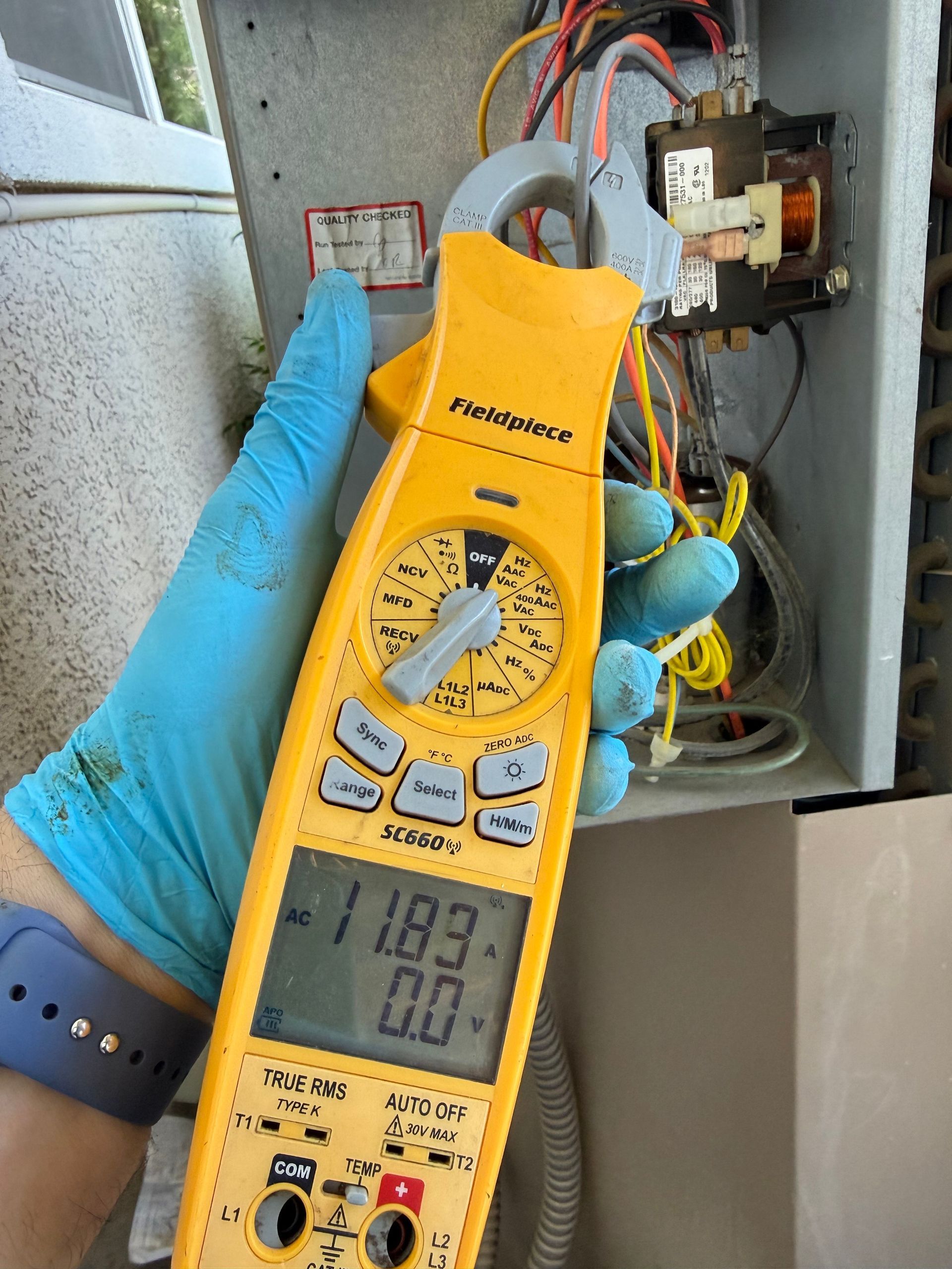 Refrigerant manifold gauge reading on Matt's system showing borderline pressures