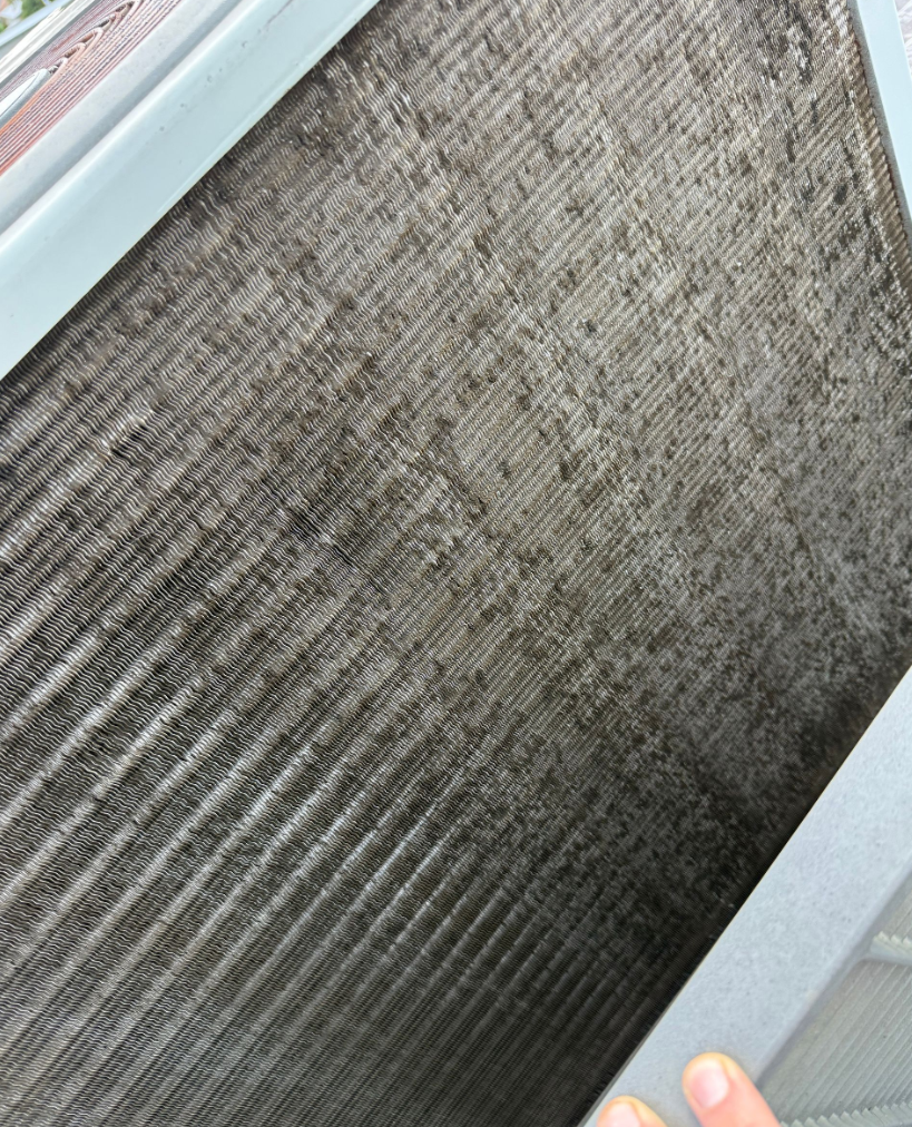 Evaporator coil with significant buildup before cleaning