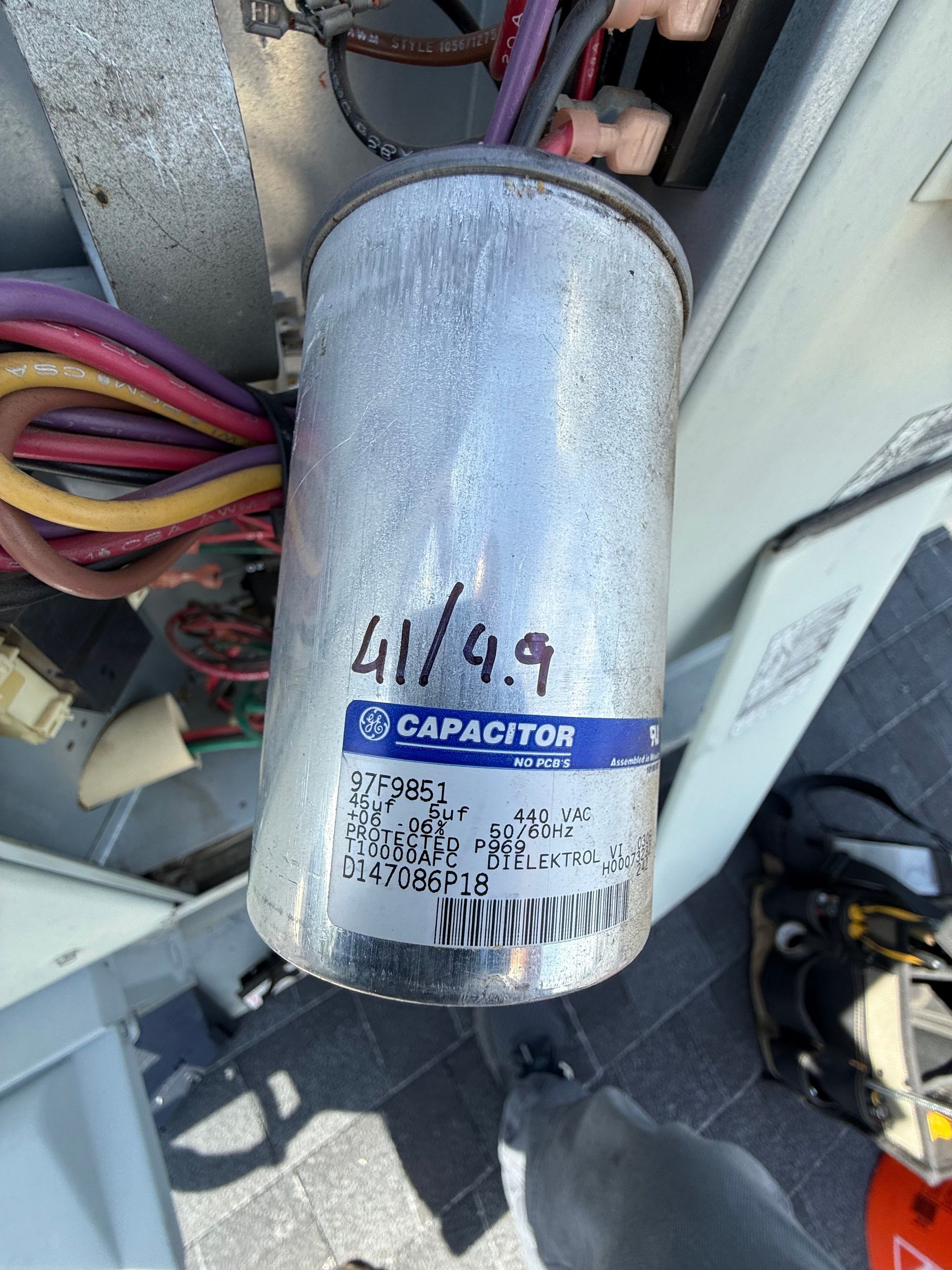 Failing dual run capacitor reading 41 microfarads on a 49 rated unit