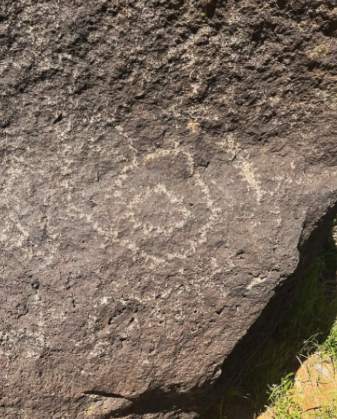 A close up of a rock with a drawing on it